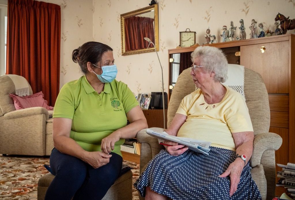 Lady enjoying some companionship with one of our amazing Domiciliary Care Assistants