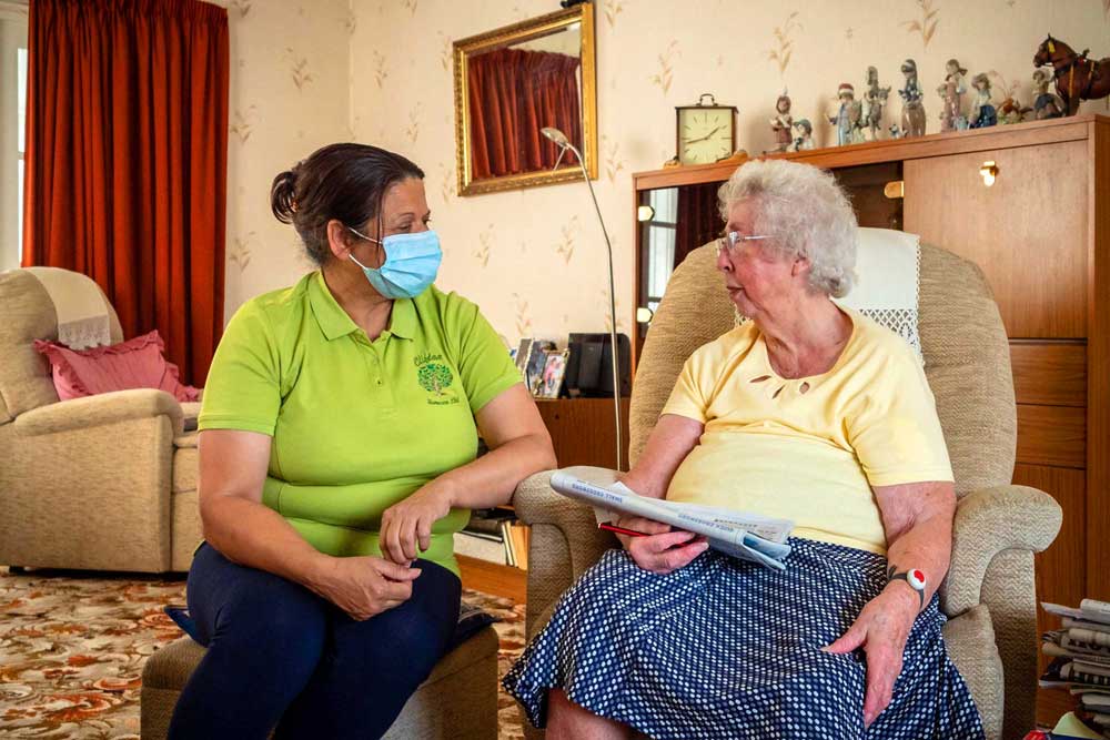 Lady enjoying some companionship with one of our amazing Domiciliary Care Assistants