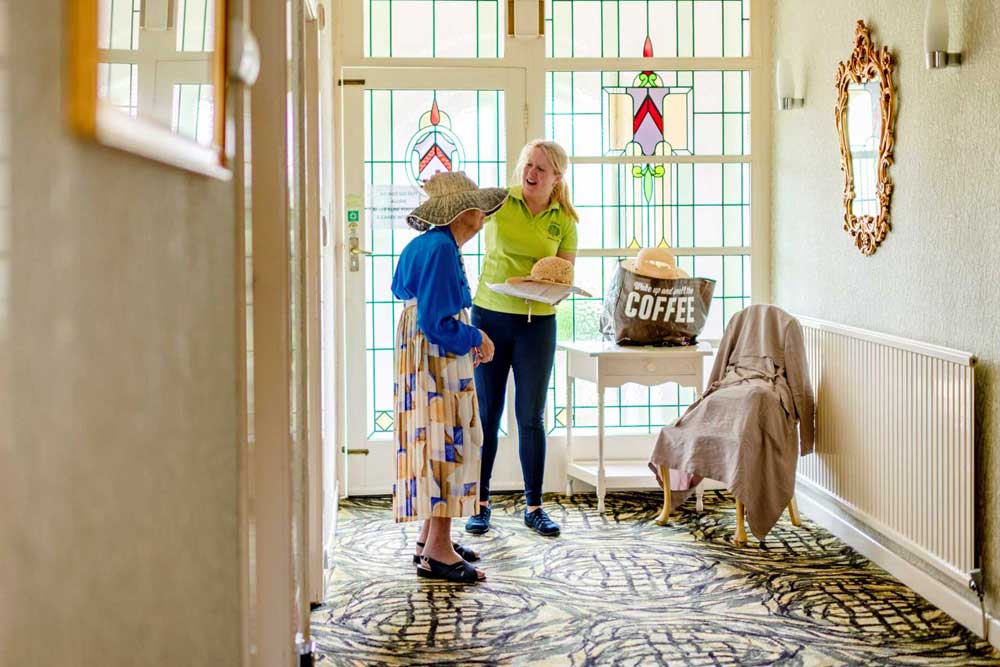 Lady receiving assistance from of one of our amazing Domiciliary Care Team